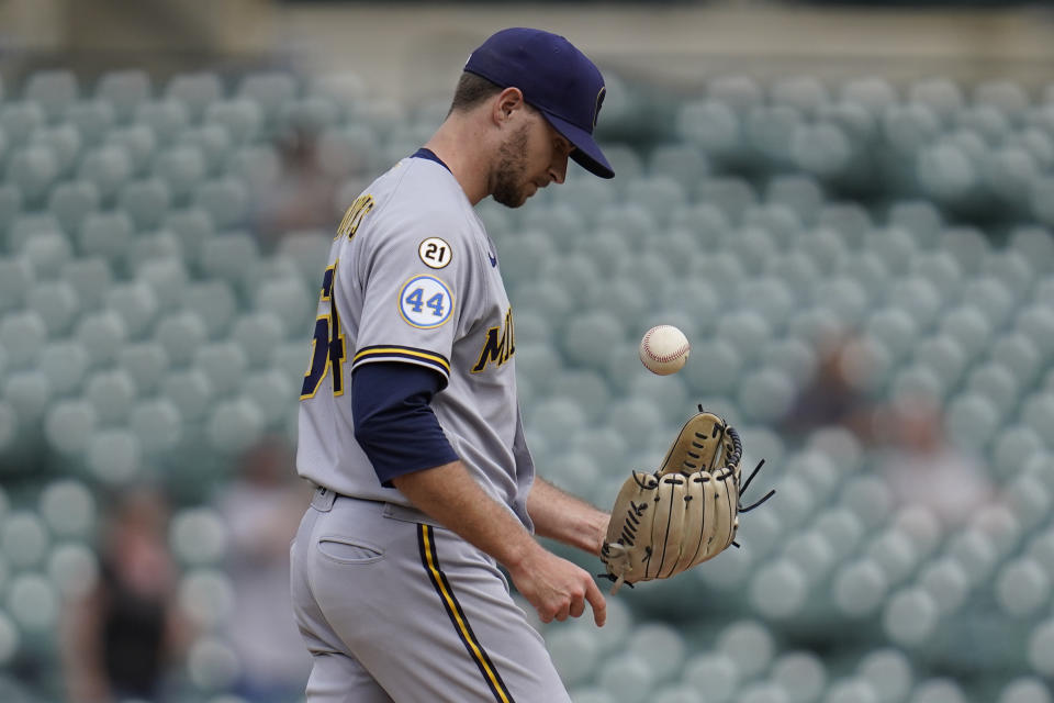 Milwaukee Brewers pitcher Jake Cousins (54) tosses a ball after allowing a Detroit Tigers' Dustin Garneau home run in the seventh inning of a baseball game in Detroit, Wednesday, Sept. 15, 2021. (AP Photo/Paul Sancya)