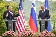 US Secretary of State Mike Pompeo, left, and Slovenia's Prime Minister Janez Jansa hold a joint press conference after their meeting in Bled, Slovenia, Thursday, Aug. 13, 2020. Pompeo is on a five-day visit to central Europe with a hefty agenda including China's role in 5G network construction. (Jure Makovec/Pool Photo via AP)