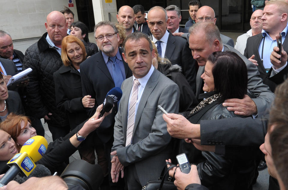 British actor Michael Turner (C), who uses the stage name Michael Le Vell, speaks to the media outside Manchester Crown Court, in north-west England, on September 10, 2013 after the star of British television soap opera Coronation Street was cleared of 12 child sex abuse charges. AFP PHOTO/ANDREW YATES        (Photo credit should read ANDREW YATES/AFP via Getty Images)