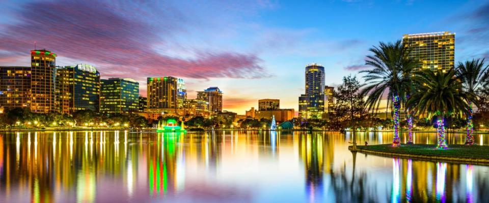 Orlando, Florida, USA downtown city skyline on Eola Lake.