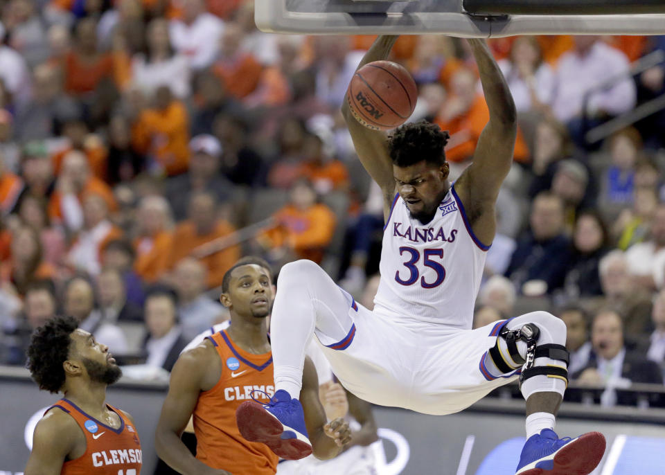 FILE - Kansas' Udoka Azubuike (35) dunks as Clemson's Gabe DeVoe, left, and Aamir Simms watch during the second half of a regional semifinal game in the NCAA men's college basketball tournament Friday, March 23, 2018, in Omaha, Neb. Kansas won 80-76. (AP Photo/Charlie Neibergall, File)