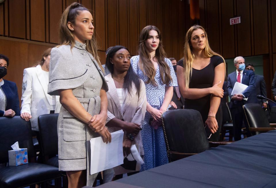 United States gymnasts from left, Aly Raisman, Simone Biles, McKayla Maroney and Maggie Nichols, leave after testifying at a Senate Judiciary hearing about the Inspector General's report on the FBI's handling of the Larry Nassar investigation on Capitol Hill, Wednesday, Sept. 15, 2021, in Washington. Nassar was charged in 2016 with federal child pornography offenses and sexual abuse charges in Michigan. He is now serving decades in prison after hundreds of girls and women said he sexually abused them under the guise of medical treatment when he worked for Michigan State and Indiana-based USA Gymnastics, which trains Olympians. (Saul Loeb/Pool via AP) ORG XMIT: WX427