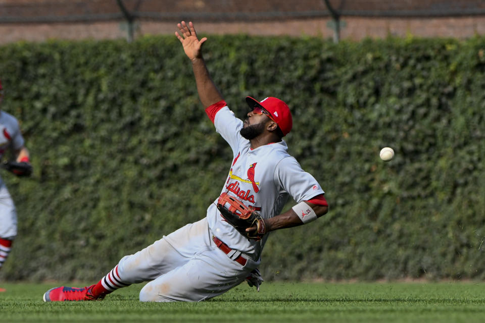 St. Louis Cardinals right fielder Dexter Fowler (25) tries to make a play on a single hit by Chicago Cubs' Nico Hoerner during the seventh inning of a baseball game Friday, Sept. 20, 2019, in Chicago. (AP Photo/Matt Marton)