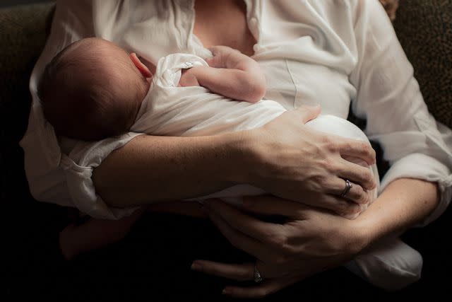 Julia Wheeler and Veronika Laws / Getty Images Stock image of mom nursing infant