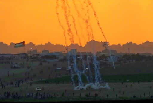 Tear gas rises amidst Palestinian protesters during clashes along the Gaza border in this picture taken from the Israeli side of the frontier on May 15, 2018