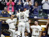 Milwaukee Brewers' Tyrone Taylor (15) is congratulated after his home run against the St. Louis Cardinals during the fourth inning of a baseball game Thursday, Sept. 23, 2021, in Milwaukee. It was Taylor's second home run of the game. (AP Photo/Jeffrey Phelps)