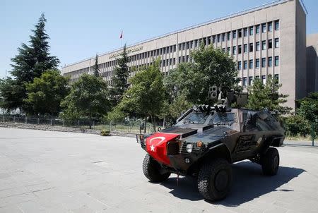 Members of police special forces keep watch from an armored vehicle in front of the Justice Palace in Ankara, Turkey, July 18, 2016. REUTERS/Baz Ratner