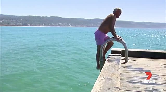 The Lorne local believes his right hook and his bright shorts may have scared off the shark. Source: 7 News.