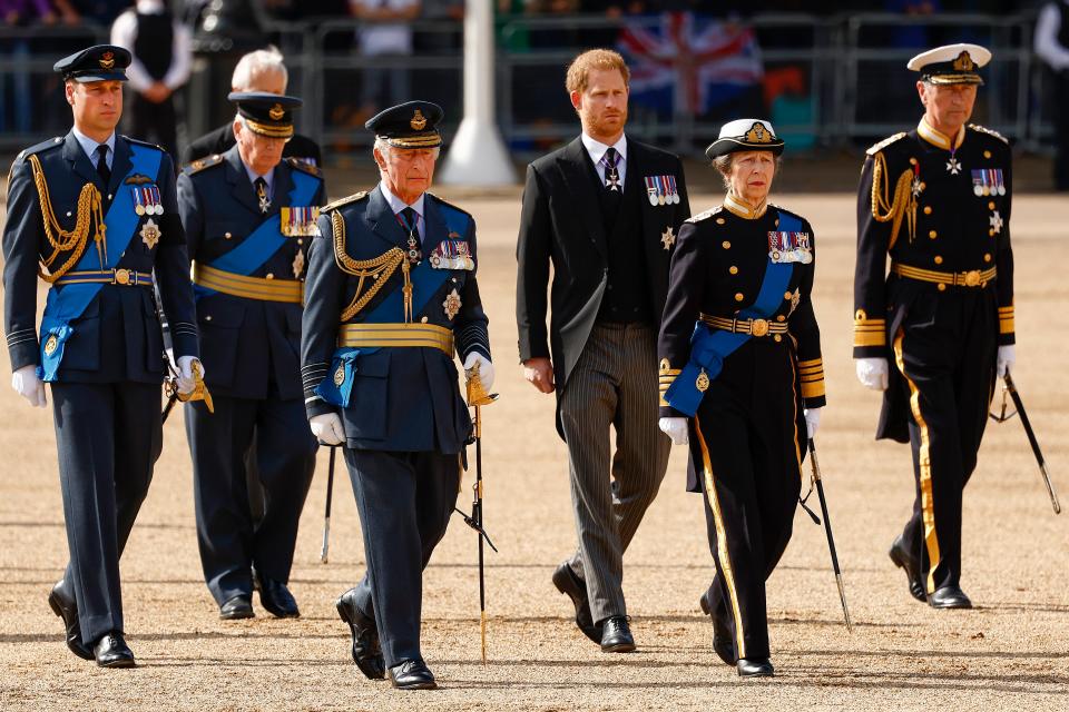 Members of the royal family process behind Queen Elizabeth's coffin.