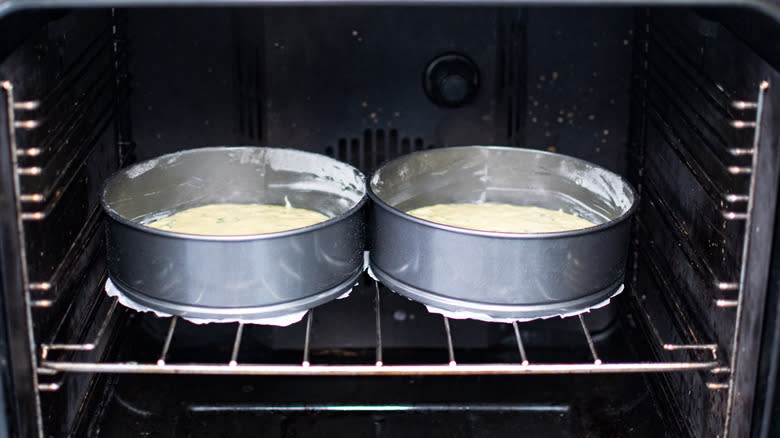 two cakes in oven