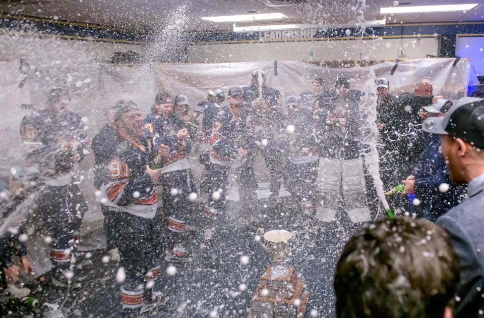 The Peoria Rivermen spray each other with champagne in the locker room after their 5-1 victory over the Huntsville Havoc in the deciding game of the SPHL President's Cup finals Sunday, April 28, 2024 at the Peoria Civic Center.