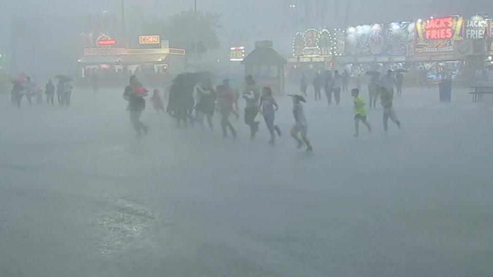 PHOTO: Rain and hail send people running for cover at NRG Park in Houston, Texas, on March 15, 2024. (KTRK)