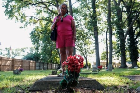 Tucker desendent Petteaway visits grave at the Tucker family cemetery in Hampton, Virginia