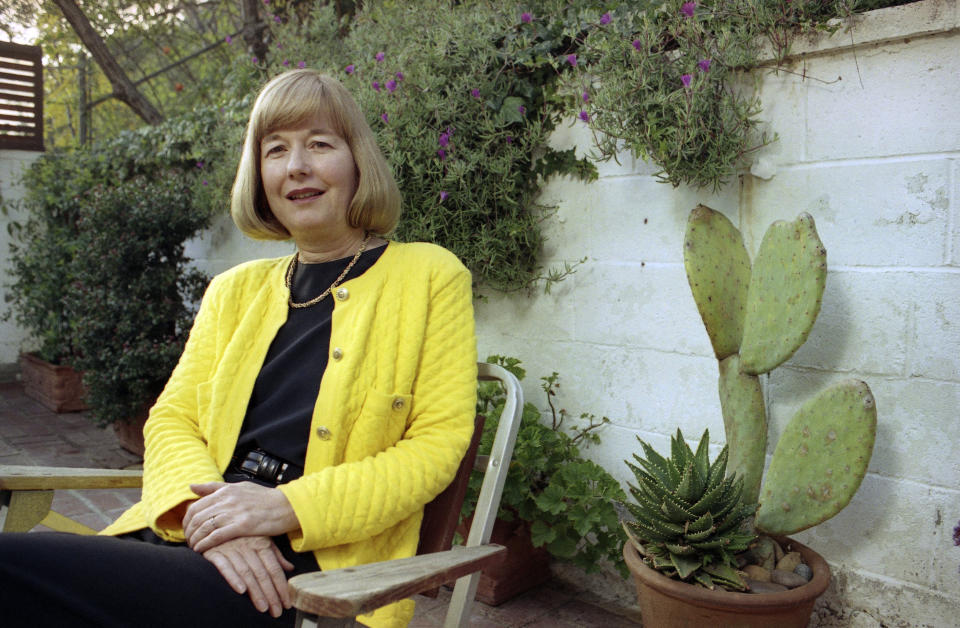 FILE - Eleanor Coppola poses at her Los Angeles home in January 1992. Coppola, who documented the making of some of her husband Francis Ford Coppola’s iconic films, including the infamously tortured production of “Apocalypse Now,” and who raised a family of filmmakers, died Friday, April 12, 2024. She was 87. (AP Photo/Craig Fujii, File)