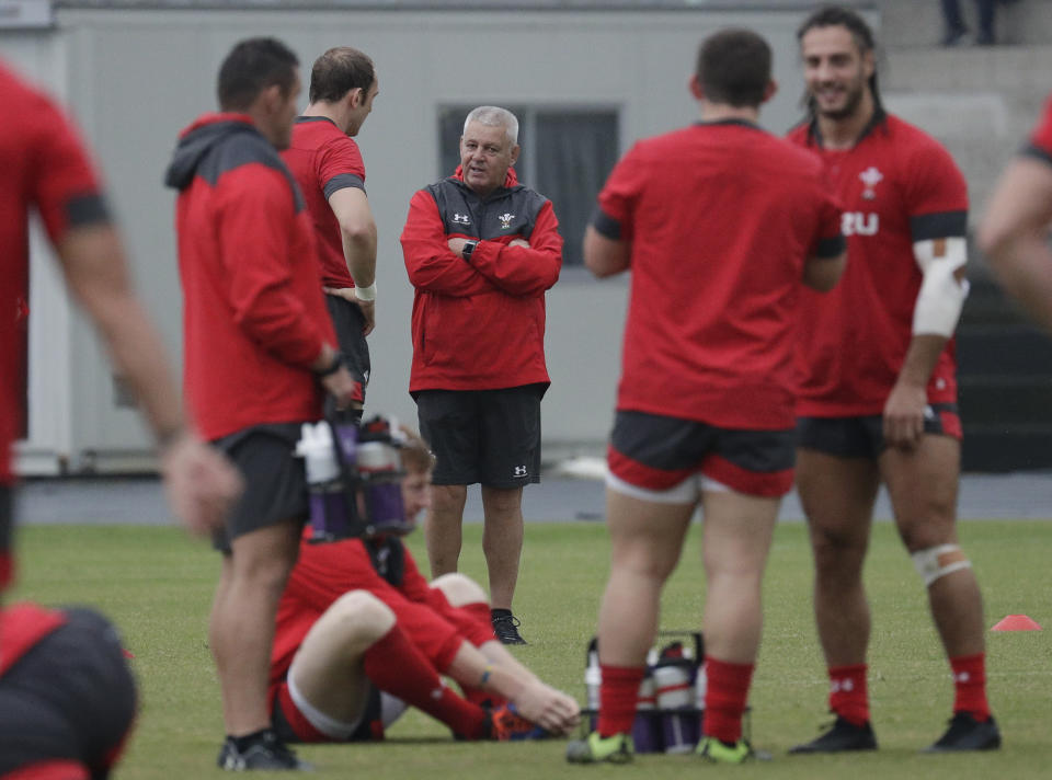 Wales rugby coach Warren Gatland talks with his team during training at Beppu, Japan, Friday Oct. 18, 2019. Wales will face France in the quarterfinals at the Rugby World Cup on Oct. 20. (AP Photo/Aaron Favila)