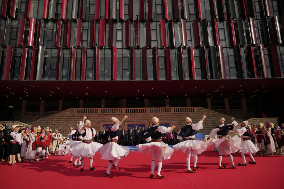 European Union and Western Balkan leaders watch a traditional dance performance after a group photo at an EU-Western Balkans Summit, in Tirana, Albania, Tuesday, Dec. 6, 2022. EU leaders and their Western Balkans counterparts gathered Tuesday for talks aimed at boosting their partnership as Russia's war in Ukraine threatens to reshape the geopolitical balance in the region. (AP Photo/Andreea Alexandru)