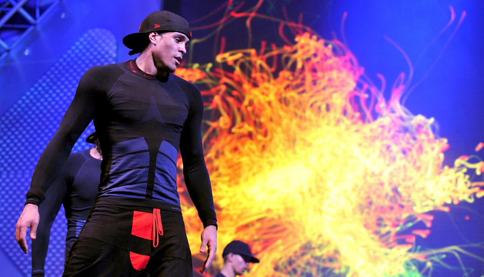 MANCHESTER, ENGLAND - APRIL 09:  (EXCLUSIVE COVERAGE) Ashley Banjo of dance troupe Diversity performs at MEN Arena on April 9, 2012 in Manchester, England.  (Photo by Shirlaine Forrest/WireImage)