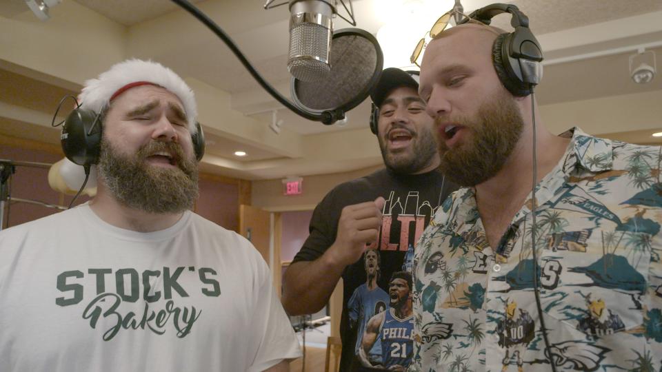 Philadelphia Eagles players Jason Kelce (left), Jordan Mailata and Lane Johnson record for their 2023 album, "A Philly Special Christmas Special," whose proceeds will go toward local organizations.