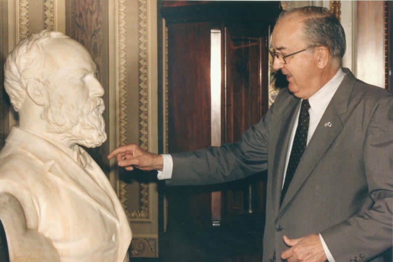 Sen. Jesse Helms views a bust of former President James Garfield. On September 19, 1881, Garfield, 49, who had been shot in July by a disgruntled office-seeker, died of his wounds. File Photo by Leighton Mark/UPI