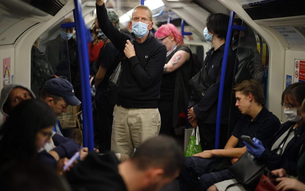 Commuters on the Victoria line in London this week