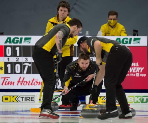 Team Mike McEwen earned an opening win on Wednesday in Ottawa at the Canadian Curling Trials.  (Curling Canada/Twitter - image credit)