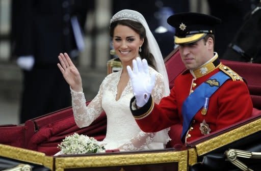 Prince William and his wife Catherine, Duchess of Cambridge, wave to crowds in the 1902 State Landau carriage in London on their wedding day on April 29. The couple celebrate their first wedding anniversary on Sunday