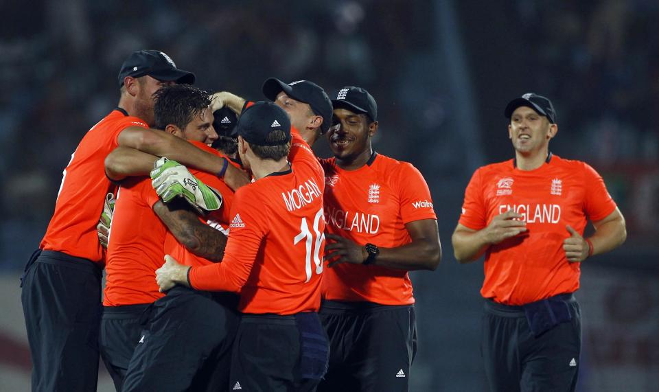 England's cricketers celebrate assuming the dismissal of Sri Lanka's Mahela Jayawardena, who was declared not out, during their ICC Twenty20 Cricket World Cup match in Chittagong, Bangladesh, Thursday, March 27, 2014. (AP Photo/A.M. Ahad)