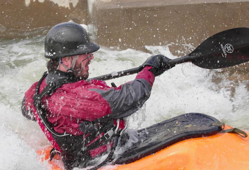 A kayaker takes on a rapid on March 19 in the “paperclip” in Great Falls, S.C.