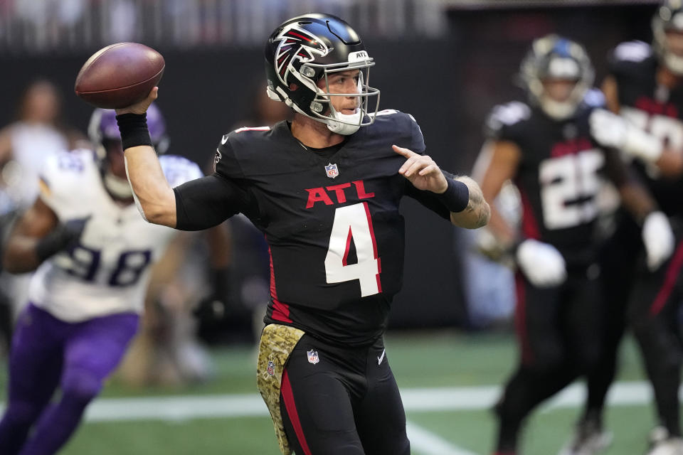 Atlanta Falcons quarterback Taylor Heinicke (4) looks to throw a pass during the first half of an NFL football game against the Minnesota Vikings, Sunday, Nov. 5, 2023, in Atlanta. (AP Photo/Mike Stewart)