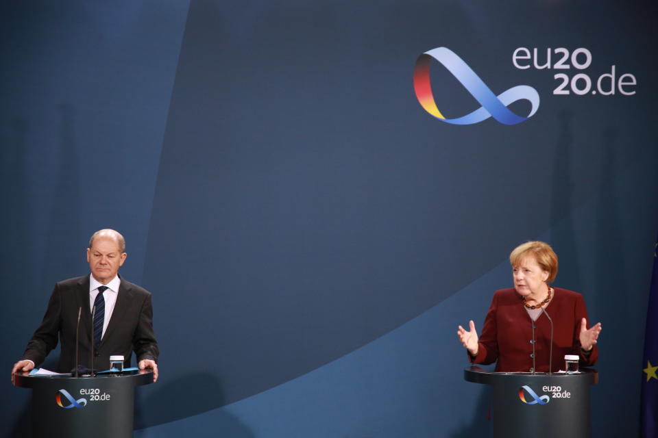 German Chancellor Angela Merkel and Federal Finance Minister and Vice Chancellor, Olaf Scholz speak to the media on November 22, 2020 in Berlin, following a virtual G20 summit. Photo: Christian Marquardt/Getty Images