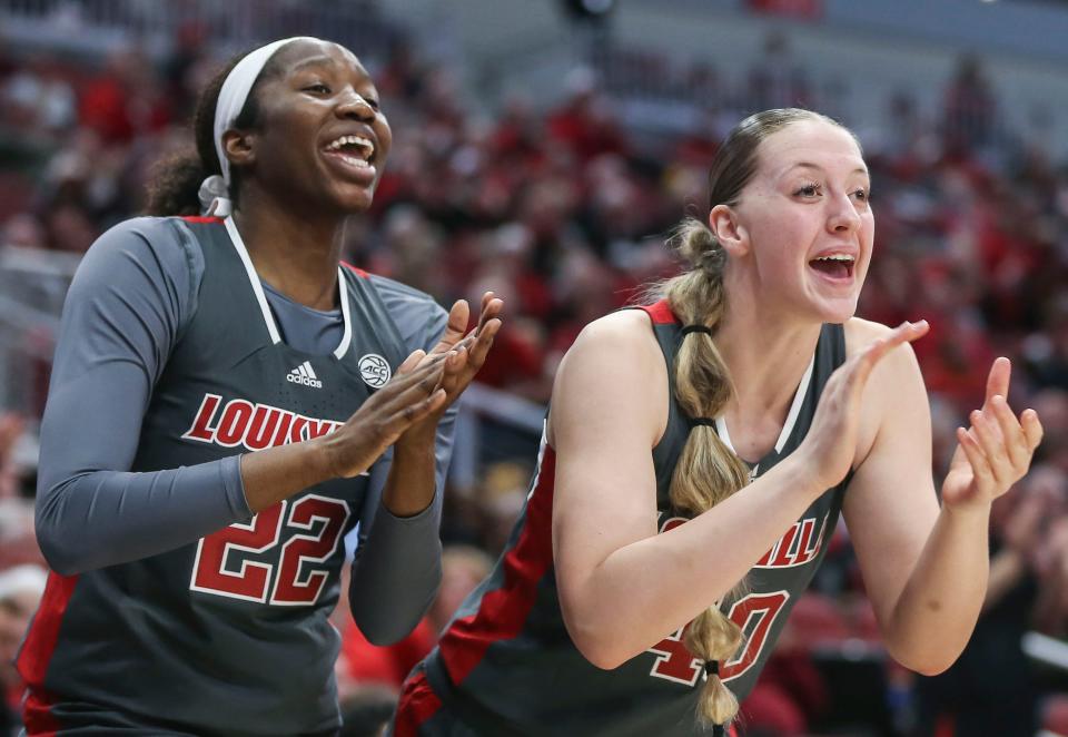 Louisville's Liz Dixon and Louisville's Josie Williams cheer their teammates from the bench in Thursday night's game. The Cards won 63-55; the Cards had 31 team rebounds and eight total turnovers. Jan. 5, 2023