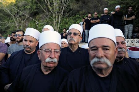 Members of the Druze community attend the funeral of Druze police officer Kamil Shanan at the northern village of Hurfeish, Israel July 14 2017 REUTERS/Ammar Awad