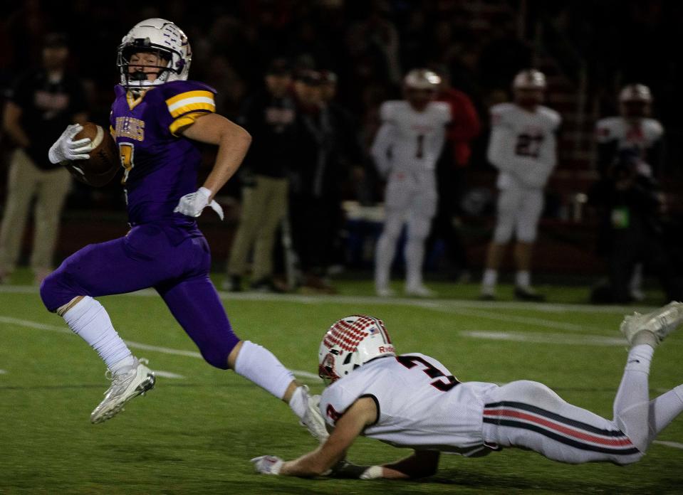 Dylan Armentrout breaks a tackle during the Division III state semifinal at London High School on Nov. 25, 2022 in London, Ohio. Bloom-Carroll defeated Tippecanoe 35-12, as the 5-9, 180-pound Armentrout ran 30 times for 250 yards with three touchdowns.