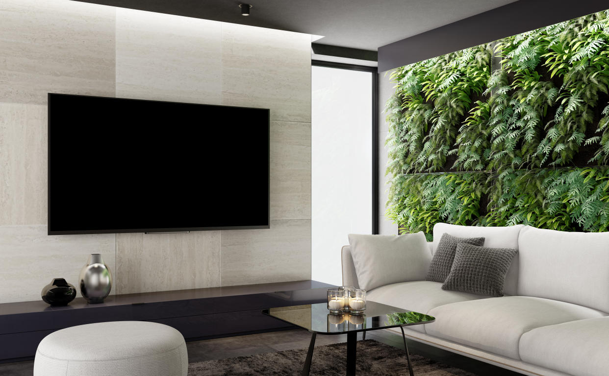 Modern and minimalist apartment interior living room with large 8k TV.