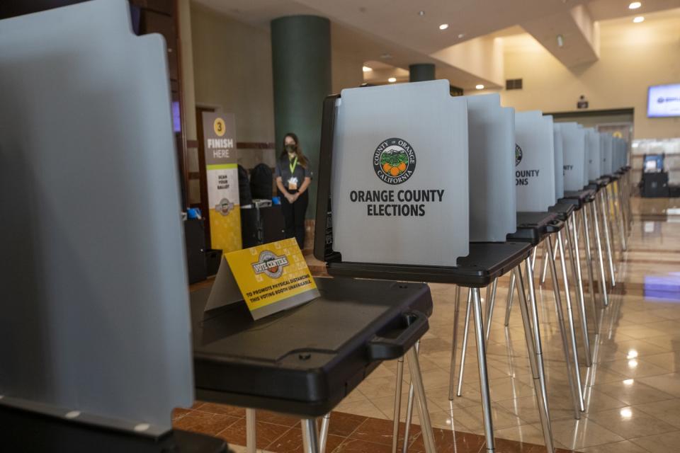 An Orange County Registrar of Voters election services worker stands at the "Super Vote Center Site."