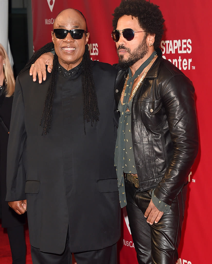 Musicians Stevie Wonder (L) and Lenny Kravitz attend the 2016 MusiCares Person of the Year honoring Lionel Richie at the Los Angeles Convention Center on February 13, 2016 in Los Angeles, California. Photo by Jason Merritt/Getty Images for NARAS