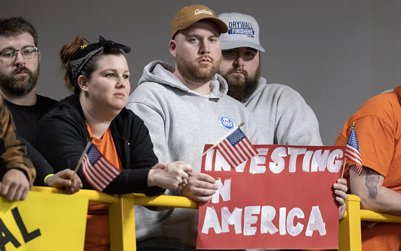 Supporters hold signs as President Biden announces his fiscal 2024 budget proposal