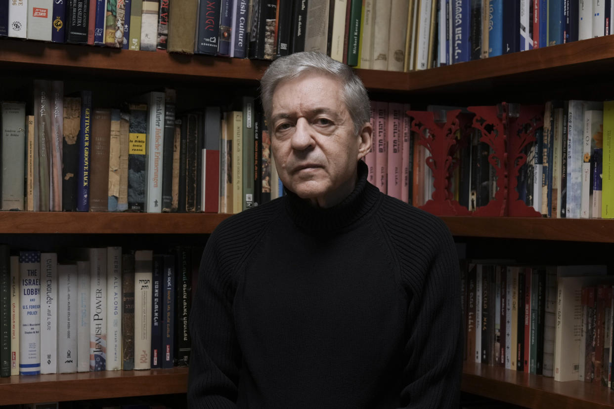 Yossi Beilin, a former senior Israeli official and peace negotiator who co-founded the Geneva Initiative, poses for a photo at his house in Tel Aviv, Israel, Sunday, Feb. 6, 2022. Israeli and Palestinian public figures, including Beilin and Hiba Husseini, a former legal advisor to the Palestinian negotiating team who hails from a prominent Jerusalem family, have drawn up a new proposal for a two-state confederation that they hope will offer a way forward after a decade-long stalemate in Mideast peace efforts. (AP Photo/Tsafrir Abayov)