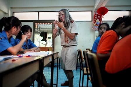Teeraphong Meesat, 29, known as teacher Bally teaches English in a classroom at the Prasartratprachakit School in Ratchaburi Province