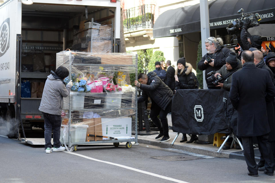 Tall trees, bundles of flowers and a $550 flat-packed crib where pictured being wheeled into the event. Photo: Splash News