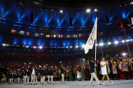 2016 Rio Olympics - Opening Ceremony - Maracana - Rio de Janeiro, Brazil - 05/08/2016. The Refugee Olympic Athletes' team arrives for the opening ceremony. REUTERS/Kai Pfaffenbach