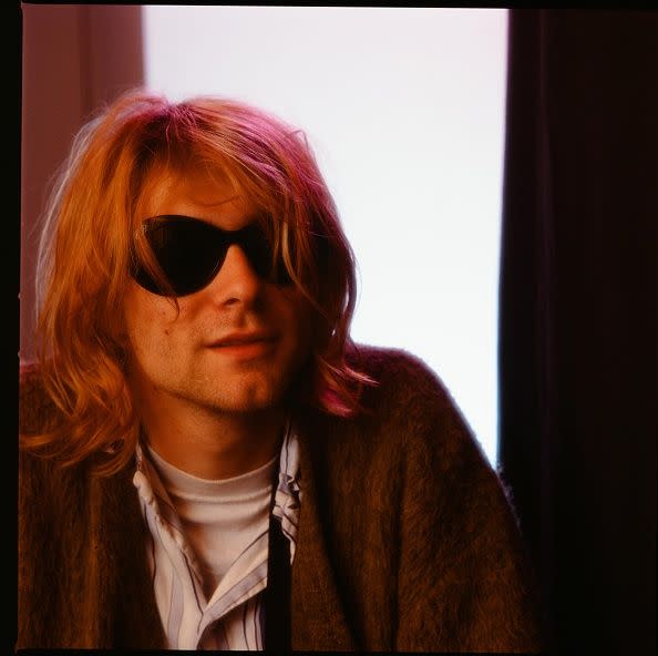 <p>Kurt Cobain at a hotel in Tokyo in November 1991. Before Nirvana, Cobain formed a band right after he dropped out of high school called Fecal Matter.</p>