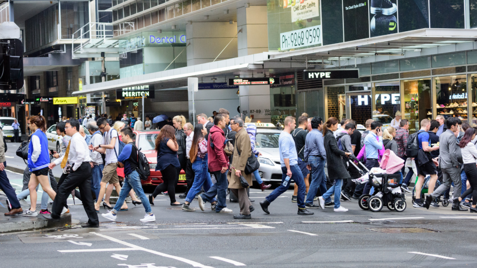 Jobs data: People crossing a busy street in the Sydney CBD.