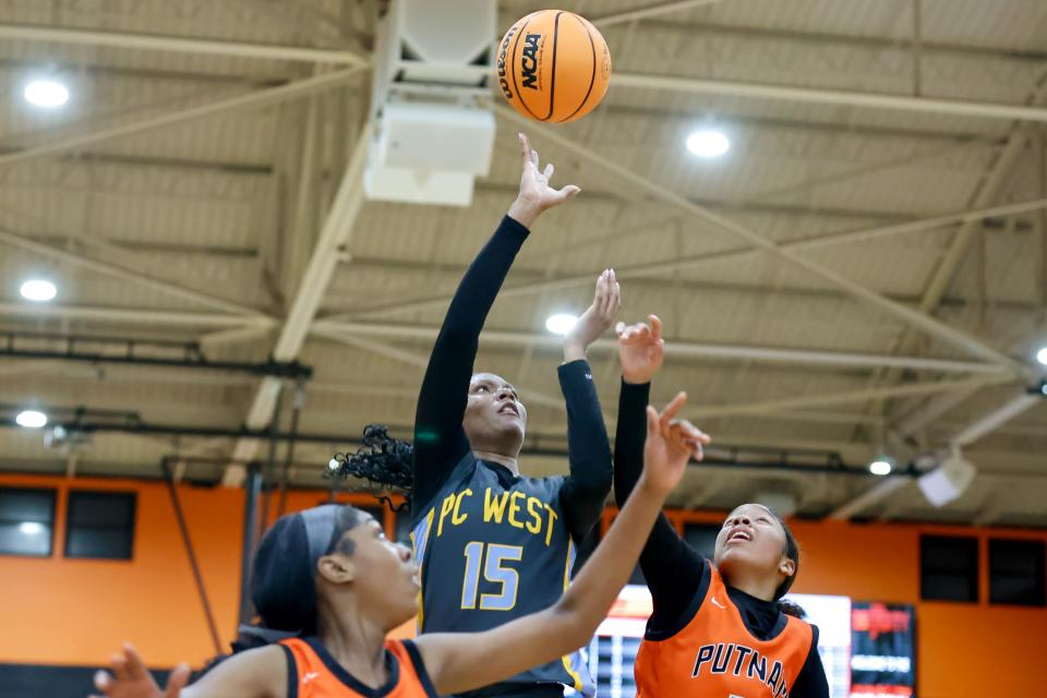 Putnam City West’s Jazzlin Brown (15) shoots the ball over Putnam City’s Chariyah Williams (3) during a Putnam City Invitational Girls Basketball game between Putnam City West and Putnam City in Oklahoma City, on Friday, Jan. 5, 2024.