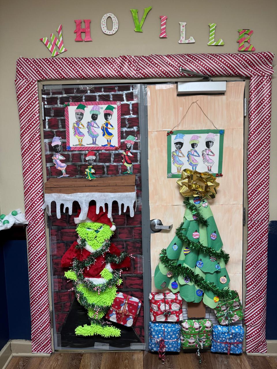 Opposite to the girls' Santa, the boys are stealing back Christmas with their fun Grinch door.