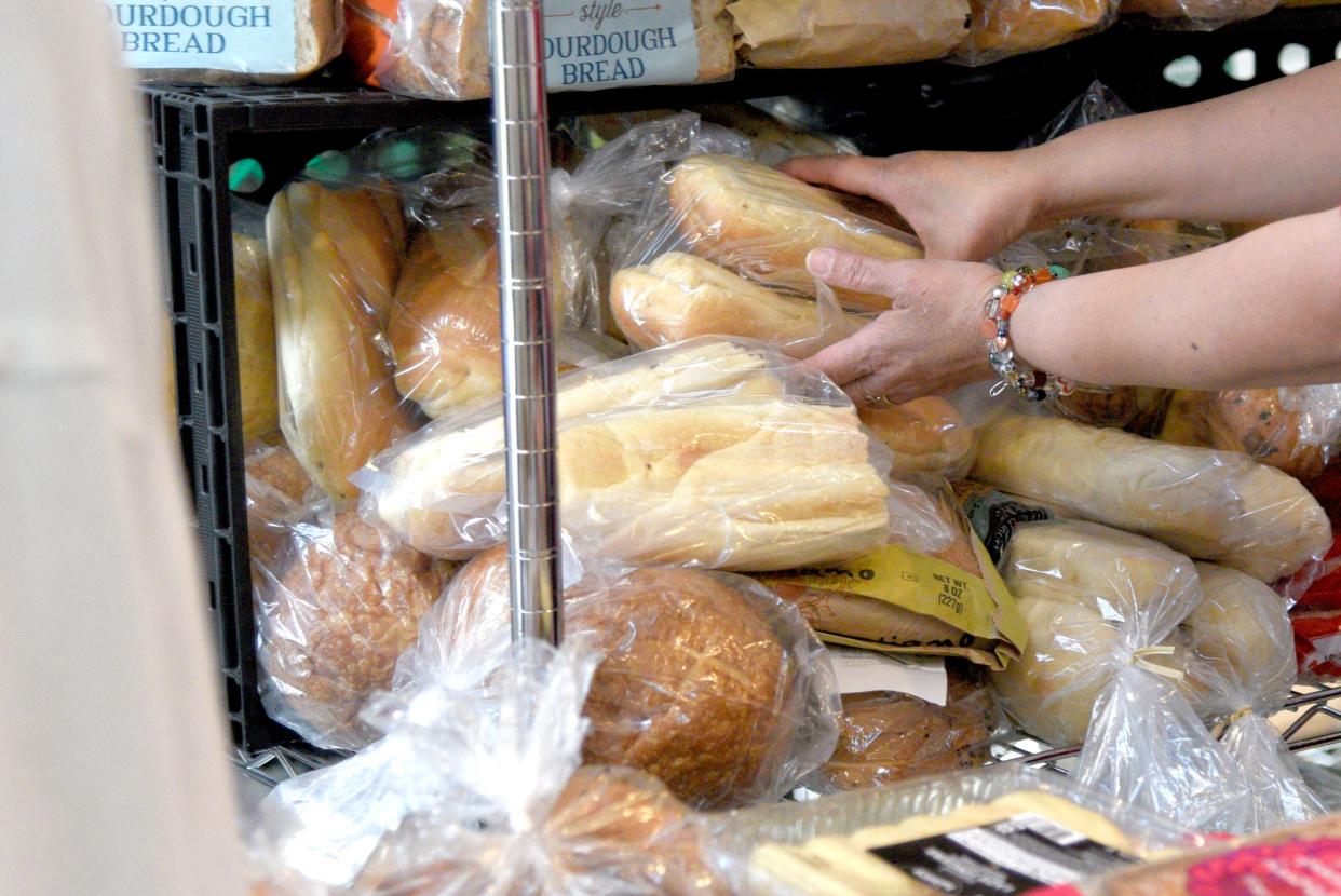 A patron selects a bag of bread from the Bradley Food Pantry on Thursday, May 2, 2024, at St. James Episcopal Church in Bradley Beach, New Jersey.