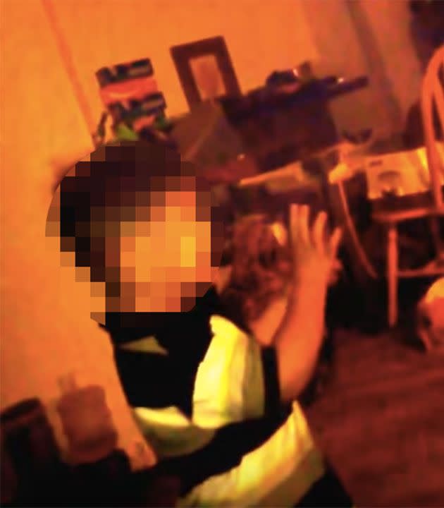 This is the shocking moment the toddler holds his hands up in fear as his mother verbally abuses him. Photo: YouTube