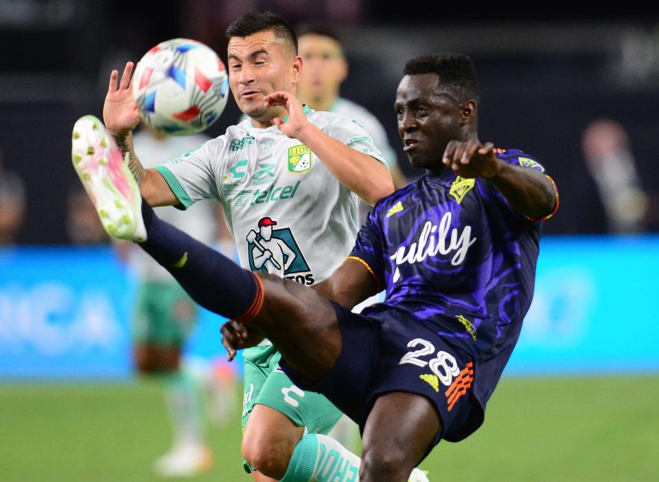 Seattle Sounders defender Yeimar Gomez (28) plays for the ball against Leon midfielder Jean Meneses during the  the Leagues Cup final at Allegiant Stadium. Leon won, 3-2.