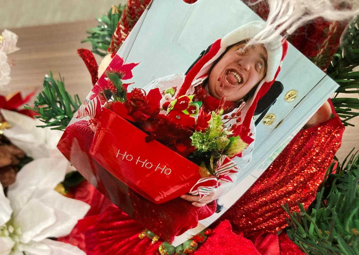 A photo of William Thompson was attached to Christmas centerpieces and wreaths made by Thompson and his mother, Lisa Feller, for families in Community PedsCare.