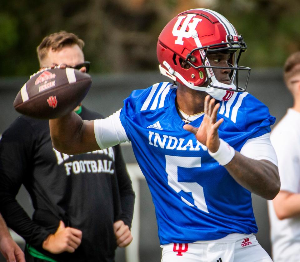 Indiana's Dexter Williams II (5) throws a pass during the first day of fall camp for Indiana football at their practice facilities on Wednesday, Aug. 2, 2023.